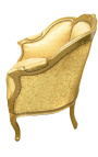 Iso bergere-nojatuoli Louis XV tyyliin kultaisella satiinikankaalla ja kultapuulla