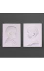 Pair of plaster child profile to be attached to the wall - negative and positive