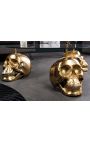 Runder Couchtisch mit goldenem Totenkopf und Glasplatte