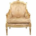 Grande bergère louis XVI stile tessuto in oro satinato con motivo e legno dorato